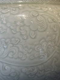 A Chinese monochrome celadon-glazed jar with anhua chilong and floral design, Kangxi