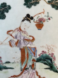 A Chinese famille rose 'He Xiangu' charger with a blue and white border, Qianlong