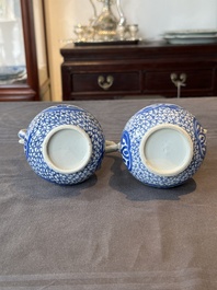 A pair of Chinese blue and white ewers with floral design, Kangxi
