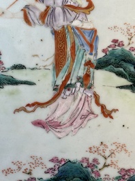 A Chinese famille rose 'He Xiangu' charger with a blue and white border, Qianlong