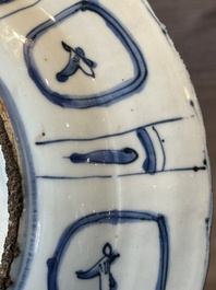 A Chinese blue and white kraak porcelain dish with flowers in a jardiniere, Wanli