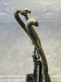 A varied collection of six Chinese bronze belt hooks, Warring States period and Western Han