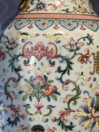 A pair of Chinese famille rose vases with floral design, Jiaqing mark, 19/20th C.