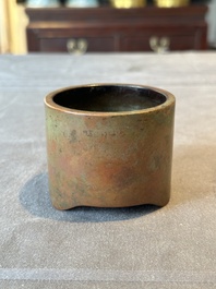 A small Chinese bronze cylindric tripod censer, Xuande mark, Ming
