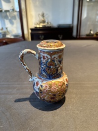 A Chinese English-decorated blue and white jug and cover, Kangxi