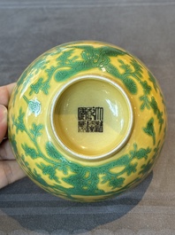 A pair of Chinese yellow-ground 'peach and bird' bowls, Qianlong mark and probably of the period