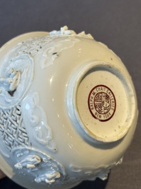 A pair of rare Chinese reticulated white-glazed biscuit 'Eight Immortals and Shoulao' bowls, Wanli