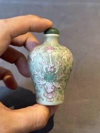 Two Chinese famille rose 'lotus scroll' snuff bottles and a flamb&eacute;-glazed snuff bottle, 19th C.