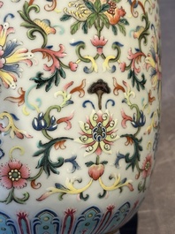 A pair of Chinese famille rose vases with floral design, Jiaqing mark, 19/20th C.