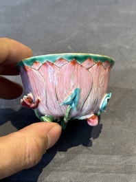 A Chinese famille rose relief-decorated 'lotus' cup and saucer, Yongzheng
