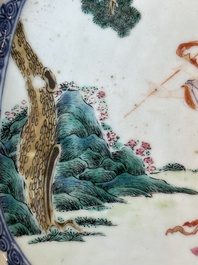 A Chinese famille rose 'He Xiangu' charger with a blue and white border, Qianlong