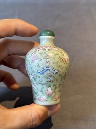 Two Chinese famille rose 'lotus scroll' snuff bottles and a flamb&eacute;-glazed snuff bottle, 19th C.