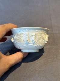 A pair of rare Chinese reticulated white-glazed biscuit 'Eight Immortals and Shoulao' bowls, Wanli