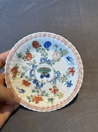 A pair of Chinese famille verte cafe-au-lait-ground cups and saucers, Kangxi