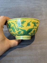 A pair of Chinese yellow-ground 'peach and bird' bowls, Qianlong mark and probably of the period