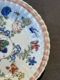 A pair of Chinese famille verte cafe-au-lait-ground cups and saucers, Kangxi