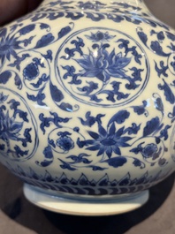 A Chinese blue and white 'lotus scroll' bottle vase, Transitional period