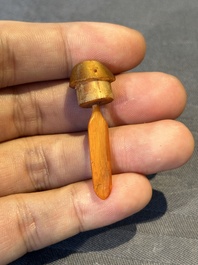 A rare Chinese rhinoceros horn snuff bottle in the shape of a Buddha hand, 19th C.
