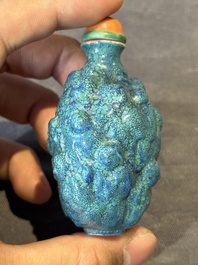 A rare Chinese robin's-egg-glazed moulded '18 Luohan' snuff bottle, 19th C.