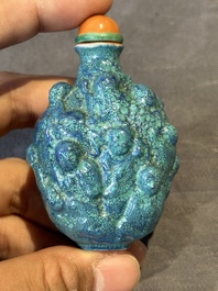A rare Chinese robin's-egg-glazed moulded '18 Luohan' snuff bottle, 19th C.