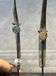 A varied collection of six Chinese bronze belt hooks, Warring States period and Western Han