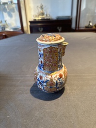 A Chinese English-decorated blue and white jug and cover, Kangxi