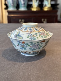 An exceptional Chinese gilt-decorated doucai and famille rose covered bowl with butterflies and floral design, Jiaqing mark and of the period