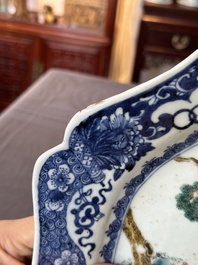 A Chinese famille rose 'He Xiangu' charger with a blue and white border, Qianlong