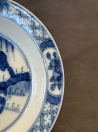 A Chinese blue and white 'erotic' cup and saucer, Kangxi