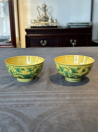 A pair of Chinese yellow-ground 'peach and bird' bowls, Qianlong mark and probably of the period