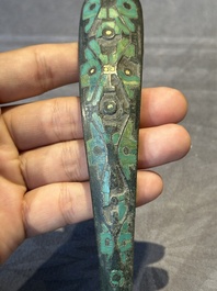 A varied collection of six Chinese bronze belt hooks, Warring States period and Western Han