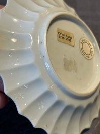 A Chinese famille rose cup and saucer with a reclined lady, Qianlong