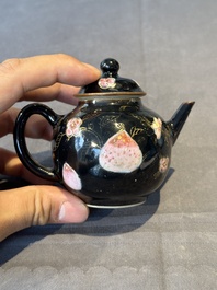 A Chinese famille verte teapot and a famille rose black-ground teapot, Kangxi/Yongzheng