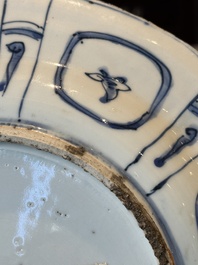 A Chinese blue and white kraak porcelain dish with flowers in a jardiniere, Wanli
