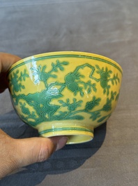 A pair of Chinese yellow-ground 'peach and bird' bowls, Qianlong mark and probably of the period