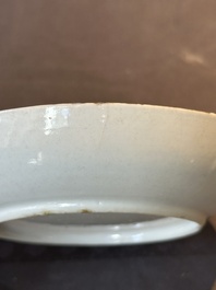 A Chinese Canton famille rose 'mandarin subject' covered teapot and a pair of saucers, Qianlong