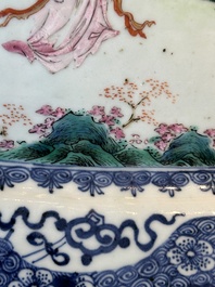 A Chinese famille rose 'He Xiangu' charger with a blue and white border, Qianlong