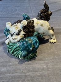 A Japanese polychrome-glazed group of playing Buddhist lions, 18/19th C.