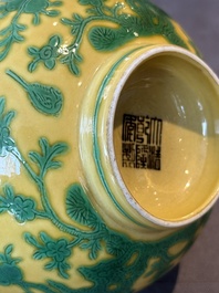 A pair of Chinese yellow-ground 'peach and bird' bowls, Qianlong mark and probably of the period