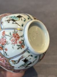 A Chinese famille rose cup and saucer with figures and animals, Yongzheng
