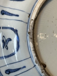 A Chinese blue and white kraak porcelain dish with flowers in a jardiniere, Wanli