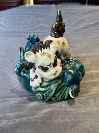 A Japanese polychrome-glazed group of playing Buddhist lions, 18/19th C.