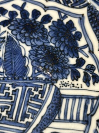 A Chinese blue and white kraak porcelain dish with flowers in a jardiniere, Wanli