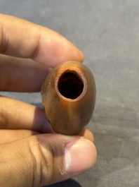 A rare Chinese rhinoceros horn snuff bottle in the shape of a Buddha hand, 19th C.