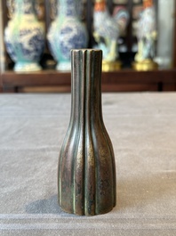 A rare Chinese ribbed bronze flower arranging vase, Ming