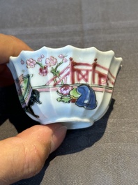 A Chinese famille rose cup and saucer with a reclined lady, Qianlong