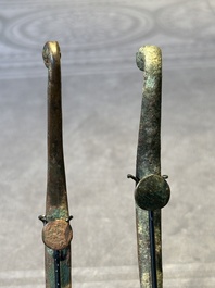 A varied collection of six Chinese bronze belt hooks, Warring States period and Western Han