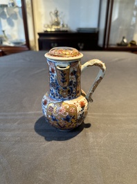 A Chinese English-decorated blue and white jug and cover, Kangxi