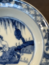 A Chinese blue and white 'erotic' cup and saucer, Kangxi