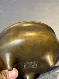 A Chinese bronze censer and stand, Xuande mark, 17th C.